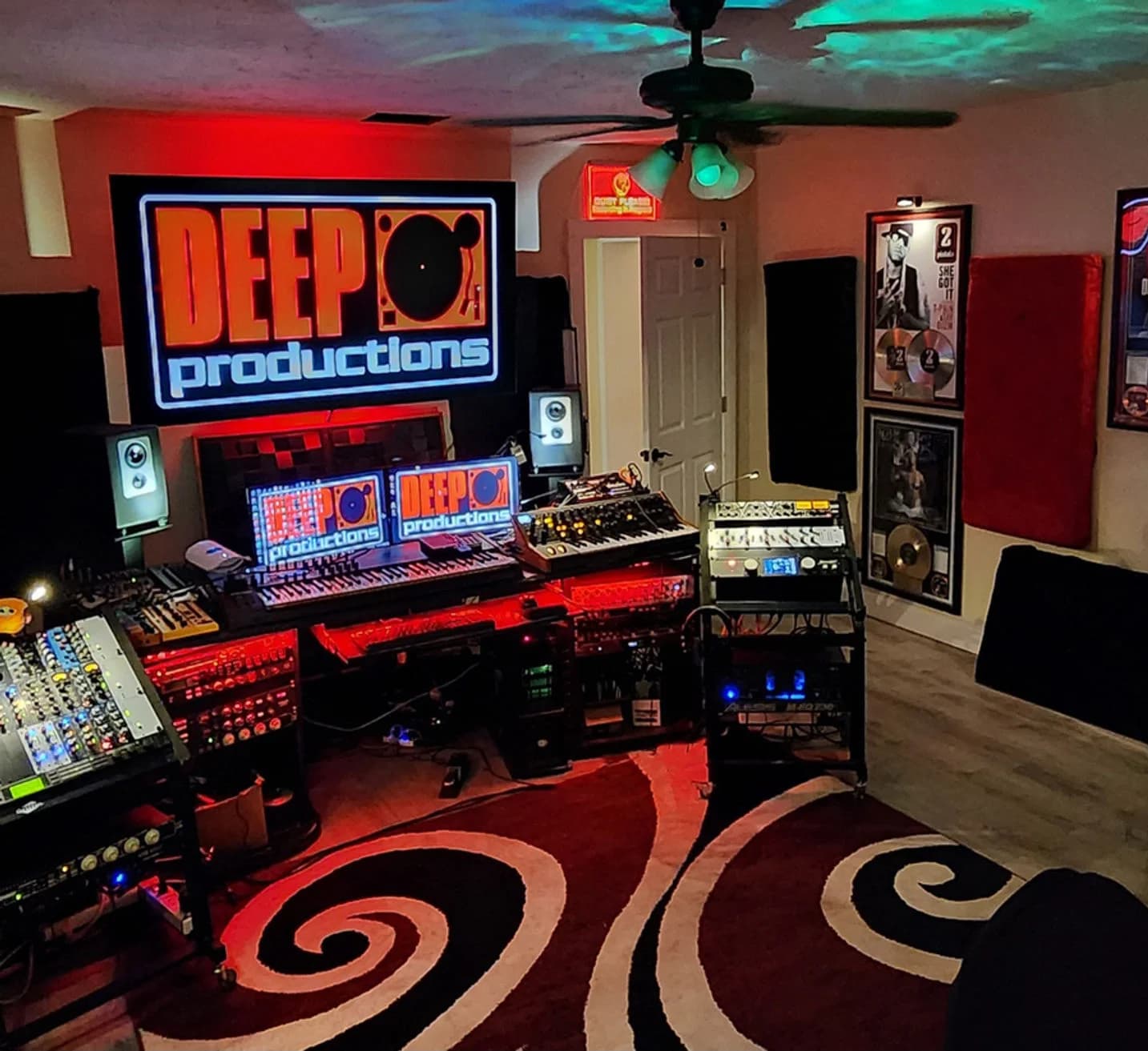 Deep Productions control room with neon sign